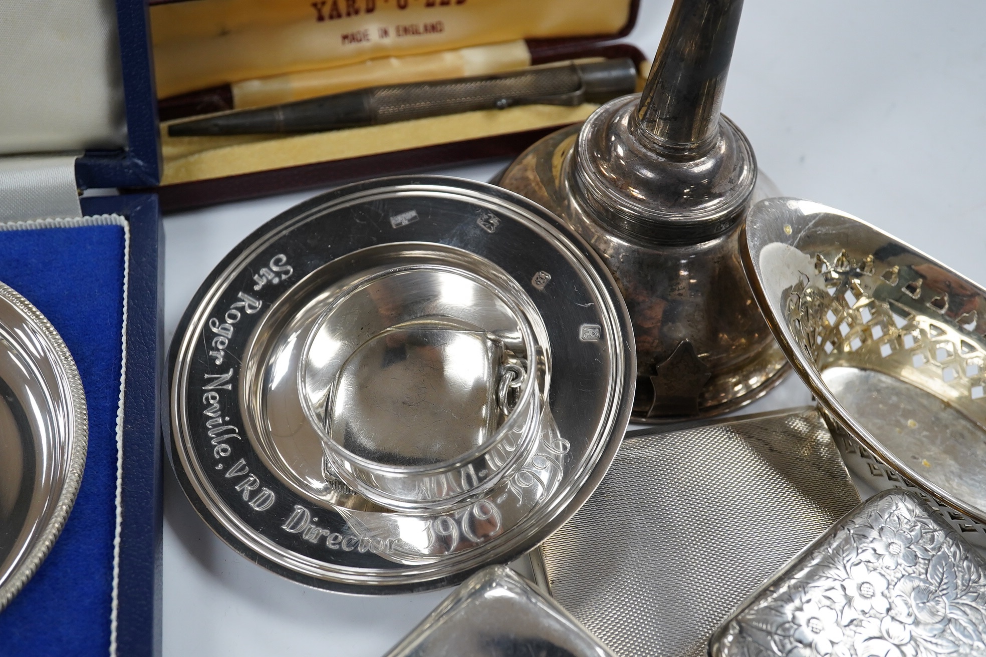 Sundry small silver including a modern wine funnel, silver dishes including cased, cigarette cases, sovereign case, wine label etc. Condition - poor to fair